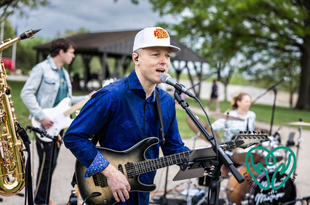 Matt singing and playing guitar