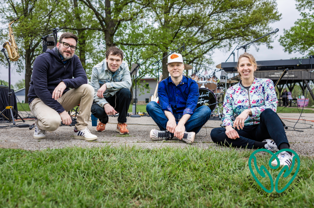 4 band members at outdoor event